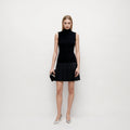 Mid to high neck sleeveless dress